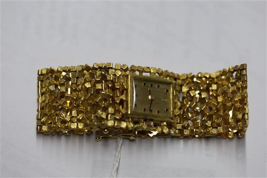 A ladys 18ct gold bracelet wristwatch by John Donald, circa 1970, with Corun movement (bracelet marked JAD) 15.2cm.